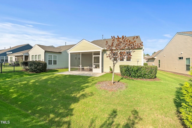 325 Currituck Ln, Durham, NC 27703 - back of property featuring a sunroom and a patio