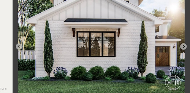 8014 Penny Rd, Raleigh, NC 27606 - view of front of property with board and batten siding, brick siding, and a front yard