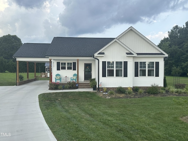 8 Open View Ln, Timberlake, NC 27583 - view of front of house featuring concrete driveway, a front lawn, and an attached carport