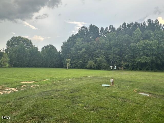 8 Open View Ln, Timberlake, NC 27583 - view of property's community featuring a lawn and a wooded view