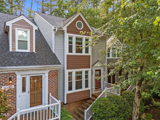 1035 High Lake Ct, Raleigh, NC 27606 - view of front of home featuring a shingled roof and brick siding