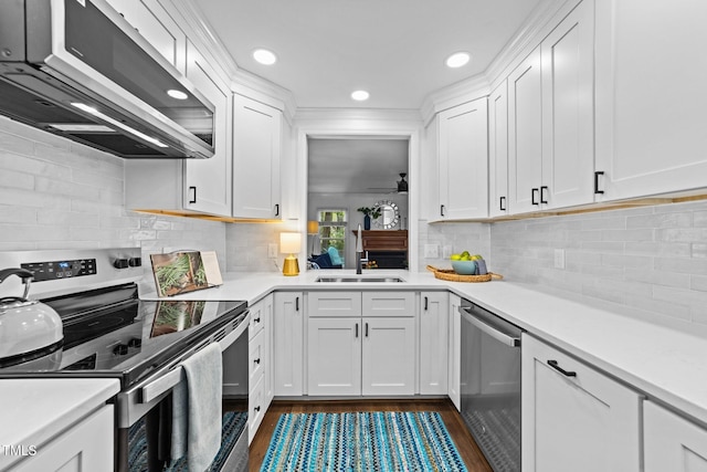 1035 High Lake Ct, Raleigh, NC 27606 - kitchen with stainless steel appliances, white cabinets, light countertops, and recessed lighting