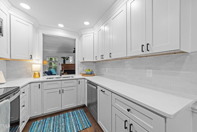 1035 High Lake Ct, Raleigh, NC 27606 - kitchen featuring electric range oven, stainless steel dishwasher, dark wood-type flooring, light countertops, and white cabinets