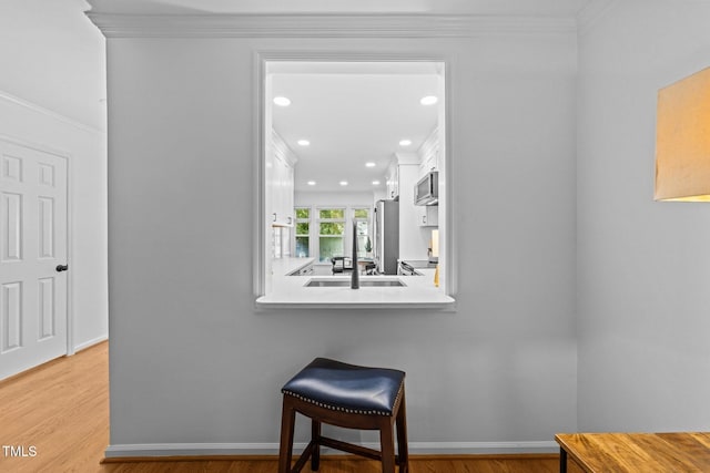 1035 High Lake Ct, Raleigh, NC 27606 - sitting room featuring ornamental molding, recessed lighting, and light wood finished floors