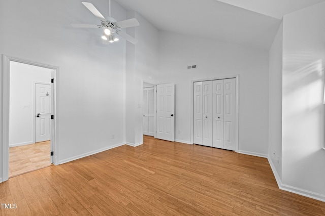 1035 High Lake Ct, Raleigh, NC 27606 - unfurnished bedroom featuring high vaulted ceiling, light wood-type flooring, and a ceiling fan