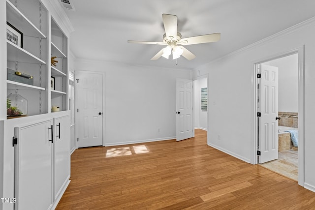 1035 High Lake Ct, Raleigh, NC 27606 - spare room featuring a ceiling fan, light wood finished floors, and crown molding