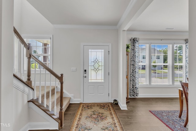 1021 Clove Pine Dr, Knightdale, NC 27545 - foyer entrance with wood finished floors, stairs, and ornamental molding