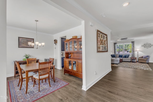 1021 Clove Pine Dr, Knightdale, NC 27545 - dining room with crown molding, a chandelier, wood finished floors, and ceiling fan