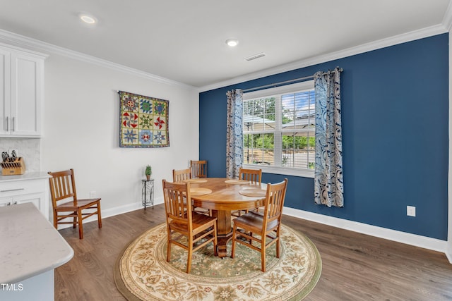 1021 Clove Pine Dr, Knightdale, NC 27545 - dining room with dark wood-type flooring, crown molding, and recessed lighting