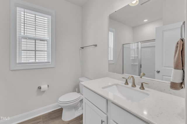 1021 Clove Pine Dr, Knightdale, NC 27545 - bathroom featuring vanity, wood finished floors, and a shower with door