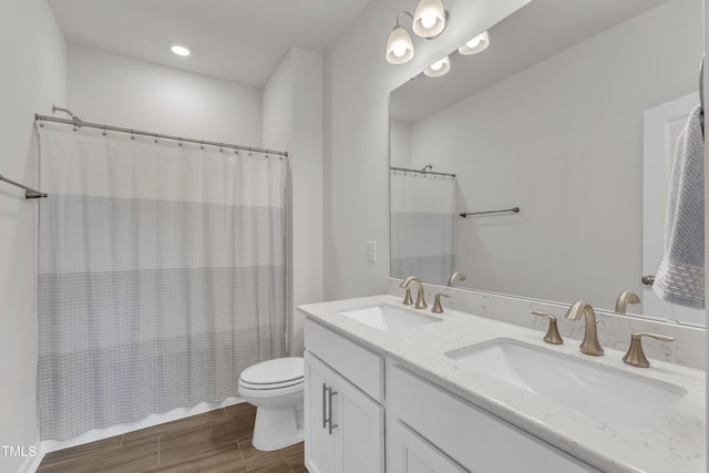 1021 Clove Pine Dr, Knightdale, NC 27545 - full bathroom featuring double vanity, wood finished floors, and shower / bath combination with curtain
