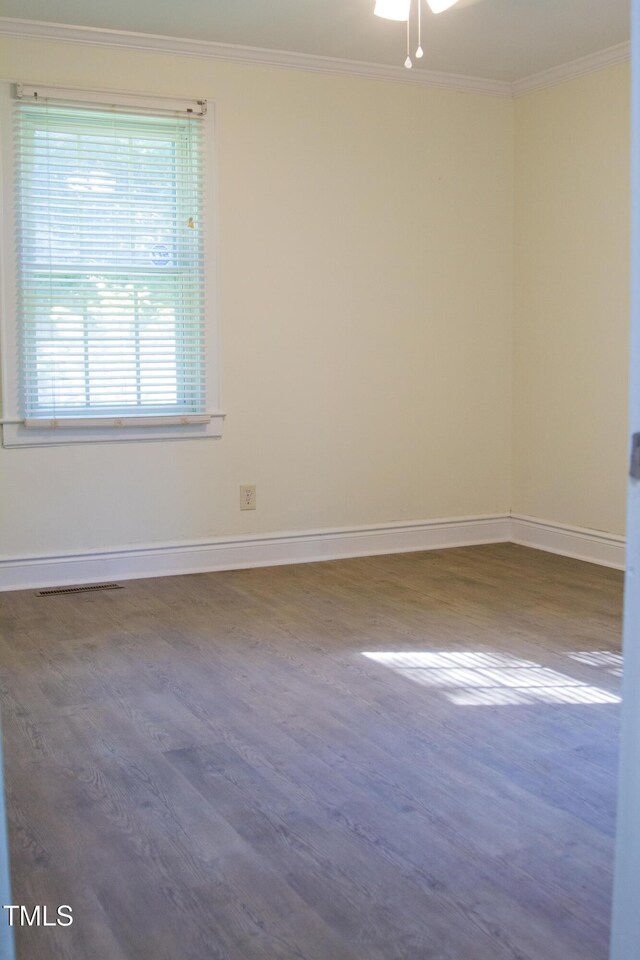 2001 Thomas Ln, Henderson, NC 27536 - empty room featuring ornamental molding, wood finished floors, and a ceiling fan
