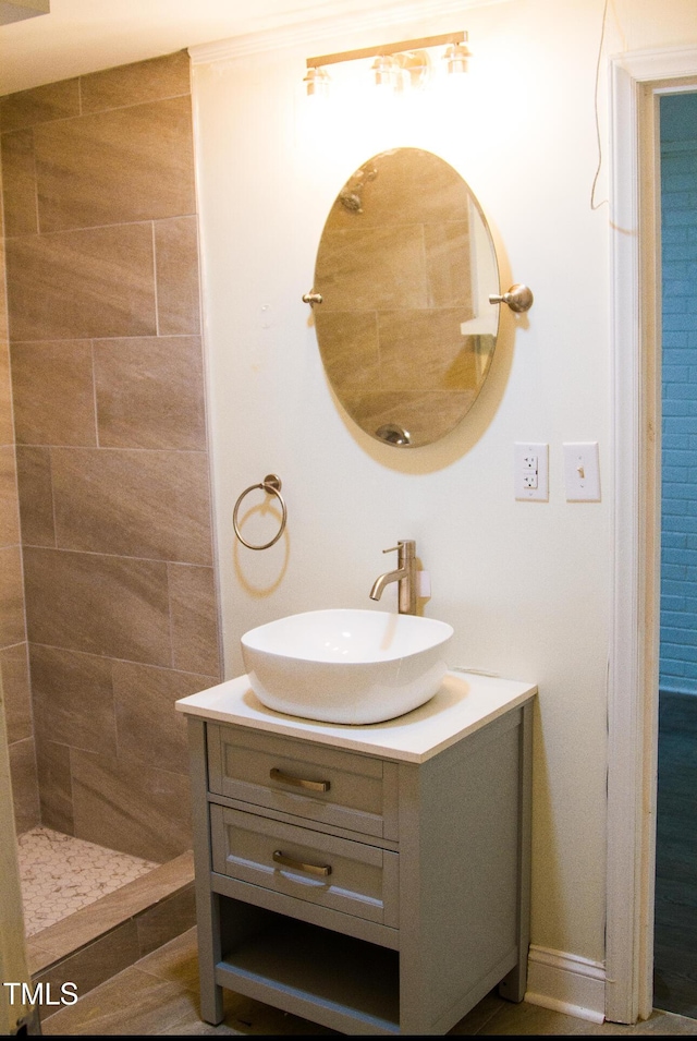 2001 Thomas Ln, Henderson, NC 27536 - bathroom featuring vanity and tiled shower
