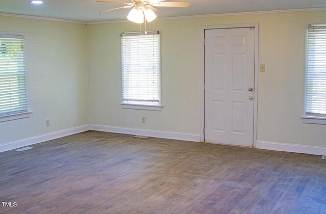 2001 Thomas Ln, Henderson, NC 27536 - spare room featuring crown molding, a ceiling fan, and wood finished floors
