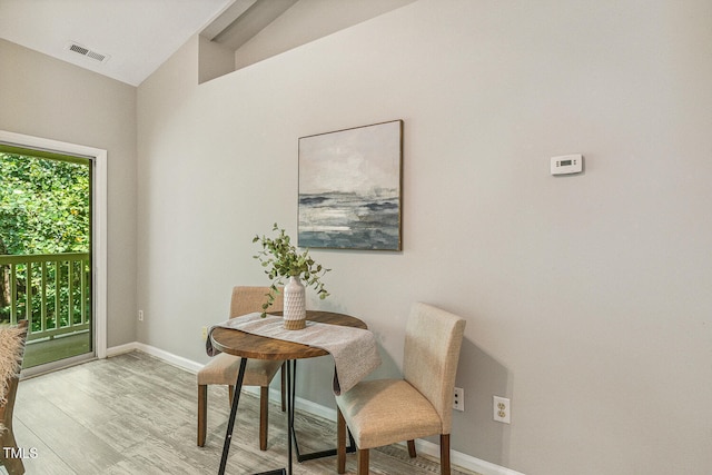 3050 Trailwood Pines Ln Unit 303, Raleigh, NC 27603 - dining area with light wood finished floors and lofted ceiling