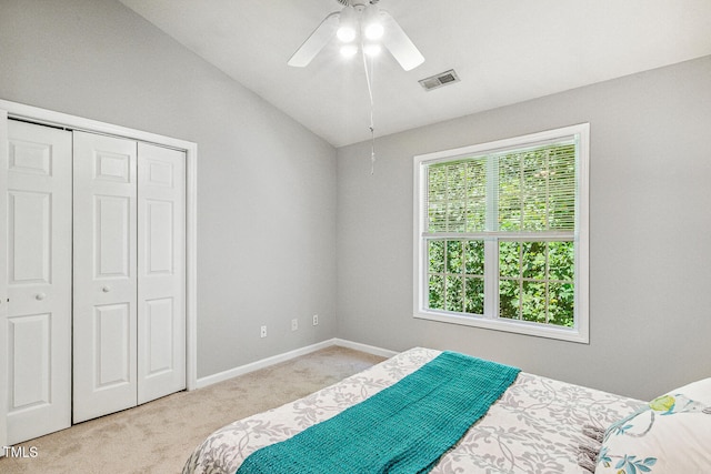 3050 Trailwood Pines Ln Unit 303, Raleigh, NC 27603 - bedroom with carpet, vaulted ceiling, a closet, and a ceiling fan