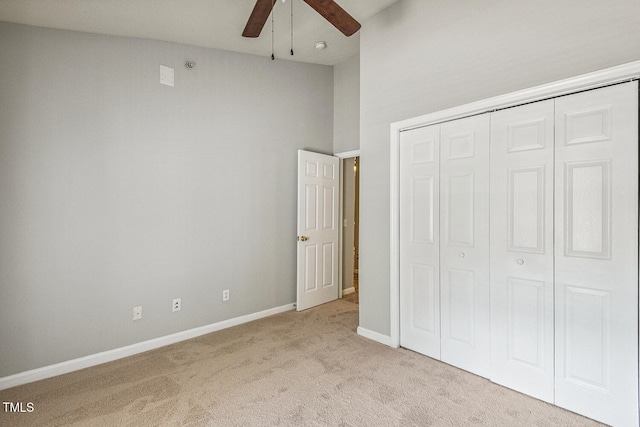 3050 Trailwood Pines Ln Unit 303, Raleigh, NC 27603 - unfurnished bedroom featuring light colored carpet, a closet, ceiling fan, and a high ceiling
