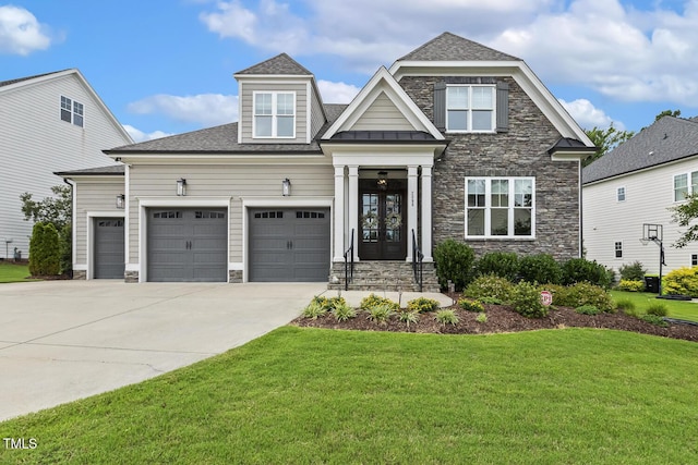 2098 Amalfi Pl, Apex, NC 27502 - craftsman-style home with stone siding, french doors, a front lawn, and driveway