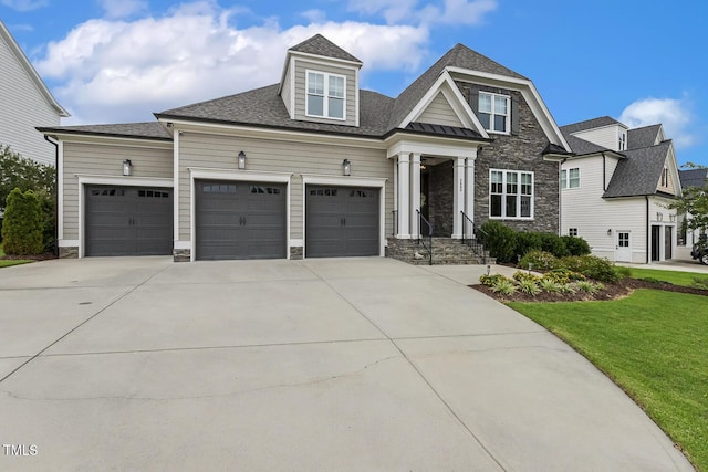2098 Amalfi Pl, Apex, NC 27502 - view of front of house featuring stone siding, an attached garage, concrete driveway, a front yard, and a shingled roof