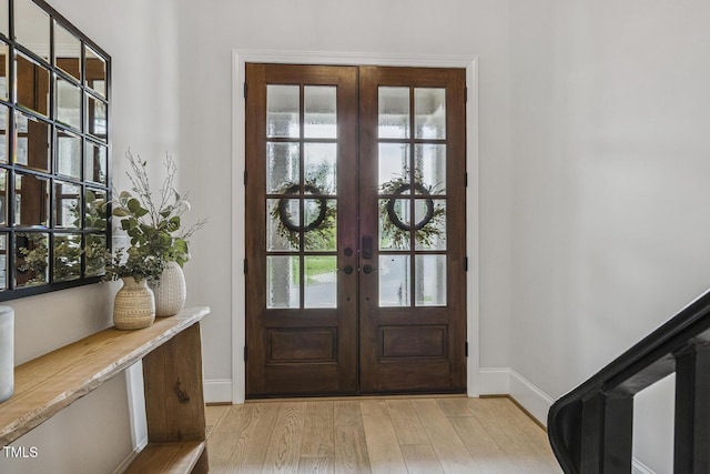 2098 Amalfi Pl, Apex, NC 27502 - foyer entrance featuring french doors and light wood-type flooring