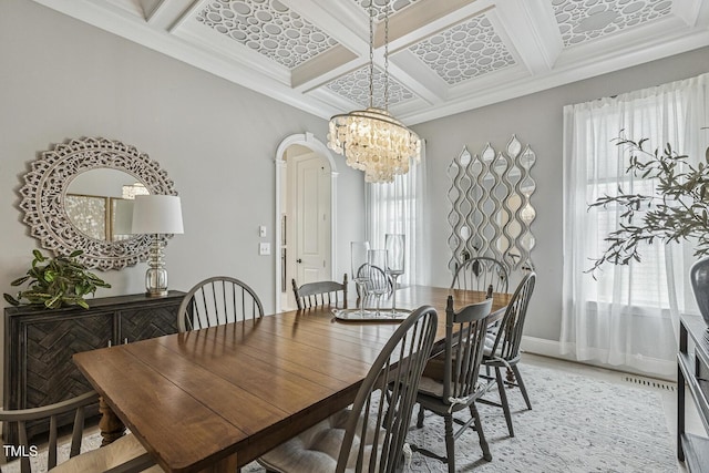 2098 Amalfi Pl, Apex, NC 27502 - dining space with coffered ceiling, a chandelier, beamed ceiling, ornamental molding, and light wood-type flooring