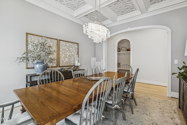 2098 Amalfi Pl, Apex, NC 27502 - dining room with arched walkways, wood finished floors, a chandelier, coffered ceiling, and beam ceiling