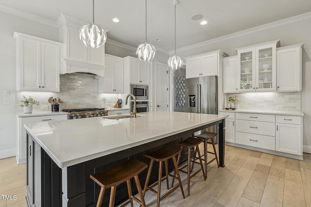 2098 Amalfi Pl, Apex, NC 27502 - kitchen with stainless steel appliances, ornamental molding, white cabinets, backsplash, and recessed lighting