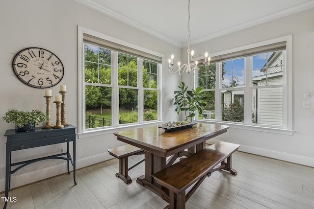 2098 Amalfi Pl, Apex, NC 27502 - dining area featuring plenty of natural light, a chandelier, crown molding, and light wood finished floors