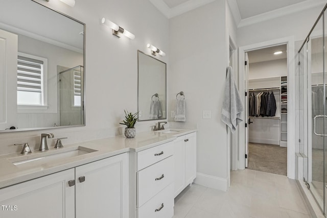 2098 Amalfi Pl, Apex, NC 27502 - bathroom featuring double vanity, a shower stall, a spacious closet, crown molding, and tile patterned flooring