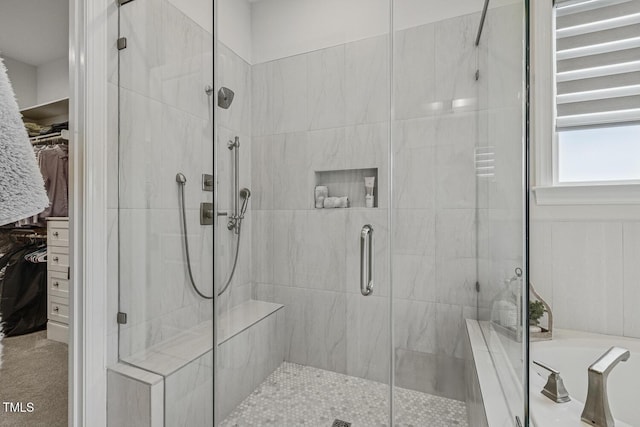 2098 Amalfi Pl, Apex, NC 27502 - bathroom featuring a bath, a shower stall, and a walk in closet