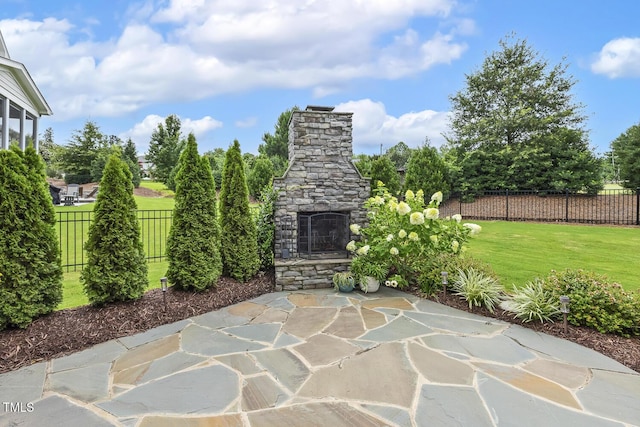 2098 Amalfi Pl, Apex, NC 27502 - view of patio with an outdoor stone fireplace