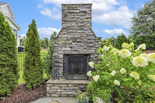 2098 Amalfi Pl, Apex, NC 27502 - exterior view of an outdoor stone fireplace