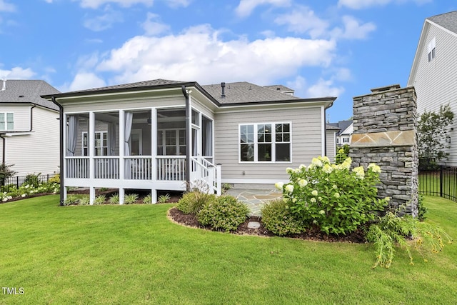 2098 Amalfi Pl, Apex, NC 27502 - back of house with a sunroom, a patio, and roof with shingles