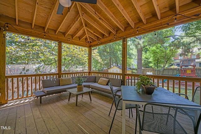 1015 W Trinity Ave, Durham, NC 27701 - wooden terrace featuring an outdoor hangout area, a fenced backyard, a playground, outdoor dining space, and a storage shed