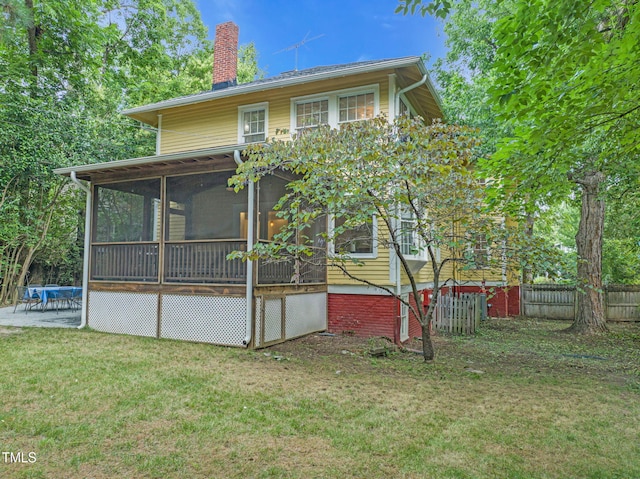 1015 W Trinity Ave, Durham, NC 27701 - back of house featuring a chimney, a sunroom, and a patio area