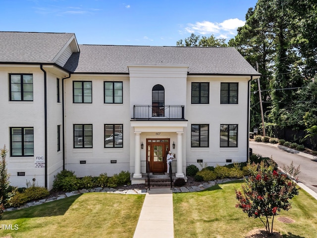 607 Smedes Pl Unit A, Raleigh, NC 27605 - view of front of home featuring a balcony, crawl space, a shingled roof, and a front lawn