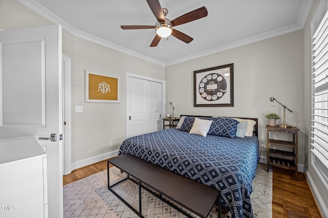607 Smedes Pl Unit A, Raleigh, NC 27605 - bedroom featuring crown molding, wood finished floors, ceiling fan, and a closet