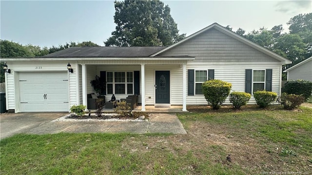2133 Coinjock Cir, Fayetteville, NC 28304 - single story home featuring covered porch, a garage, concrete driveway, and a front lawn