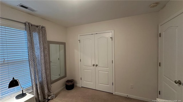 2133 Coinjock Cir, Fayetteville, NC 28304 - unfurnished bedroom with carpet flooring and a closet