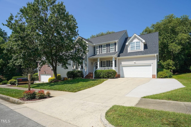 614 Park York Ln, Cary, NC 27519 - traditional-style home featuring a front yard, driveway, a garage, and a porch