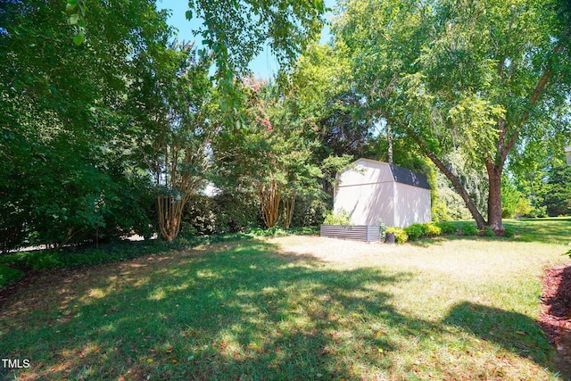 614 Park York Ln, Cary, NC 27519 - view of grassy yard featuring a storage shed