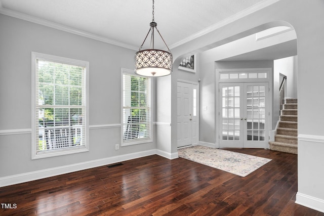 614 Park York Ln, Cary, NC 27519 - entrance foyer featuring hardwood / wood-style flooring, ornamental molding, stairway, french doors, and arched walkways