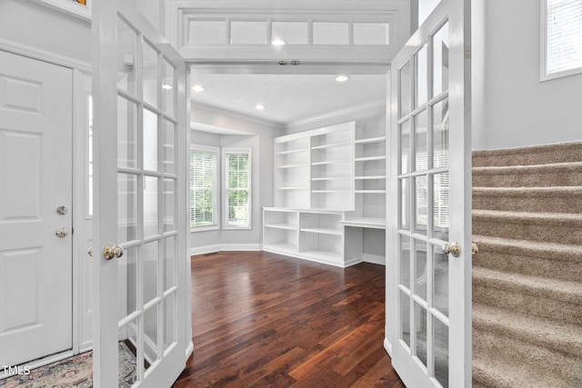 614 Park York Ln, Cary, NC 27519 - entryway featuring crown molding, wood finished floors, and french doors