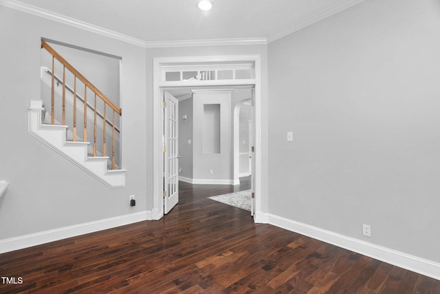 614 Park York Ln, Cary, NC 27519 - foyer featuring wood finished floors, crown molding, arched walkways, and stairs