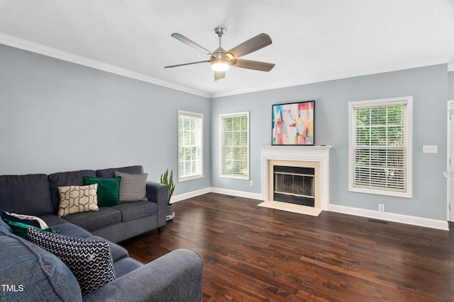 614 Park York Ln, Cary, NC 27519 - living room featuring dark wood-style floors, ornamental molding, a ceiling fan, and a fireplace with flush hearth