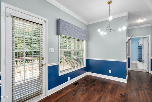 614 Park York Ln, Cary, NC 27519 - unfurnished dining area with a chandelier, ornamental molding, and wood finished floors