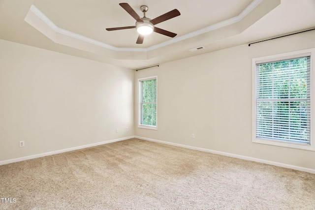 614 Park York Ln, Cary, NC 27519 - spare room with a raised ceiling, ornamental molding, plenty of natural light, and a ceiling fan