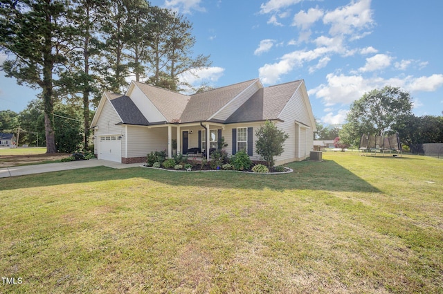1405 Currituck Ave, Dunn, NC 28334 - view of front of home featuring a trampoline, driveway, covered porch, a garage, and a front yard