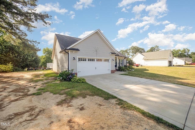 1405 Currituck Ave, Dunn, NC 28334 - view of property exterior with a garage, driveway, and a yard