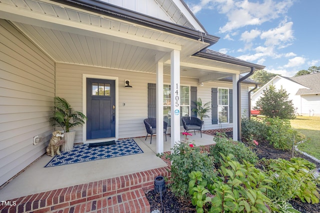 1405 Currituck Ave, Dunn, NC 28334 - entrance to property featuring covered porch and board and batten siding